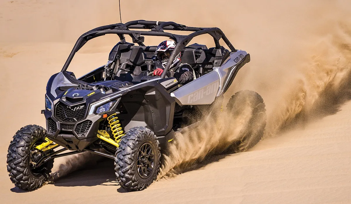 Can-Am dune buggy throwing up dust during a Dubai desert ride
