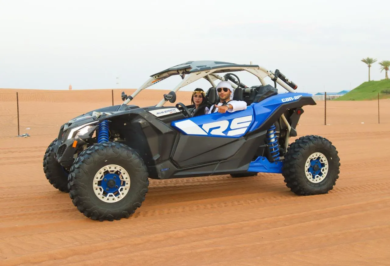 Blue Can-Am Maverick X3 RS 2-seater dune buggy in the Dubai desert